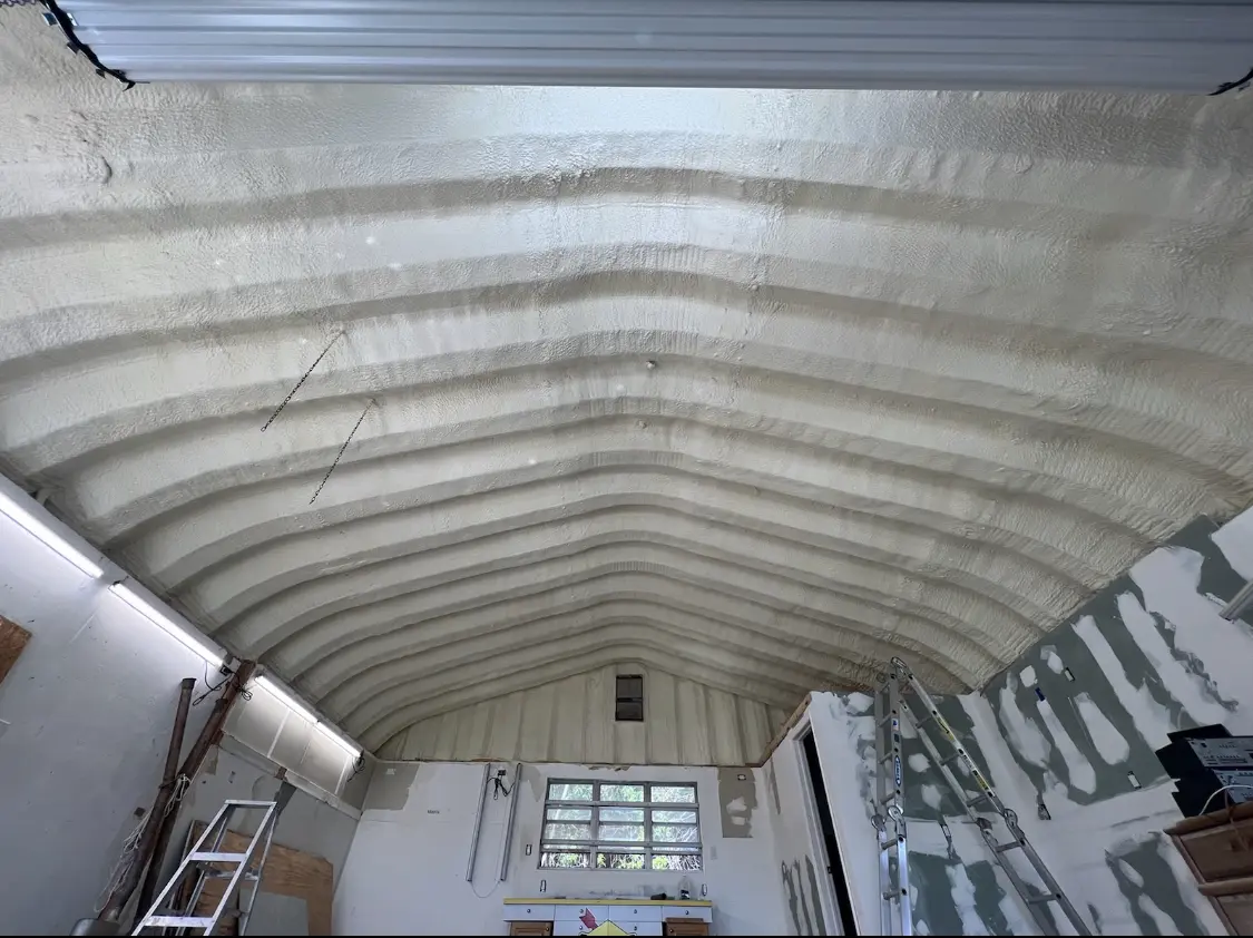 Spray polyurethane foam applied to the underside of a metal roof deck in East Port Orchard